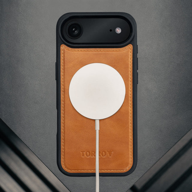 MagSafe charger attached to the Dark Brown Leather Detachable Case for iPhone 17 Air