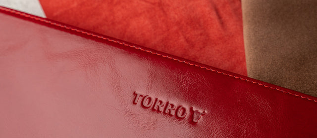 TORRO logo on a red leather accessory