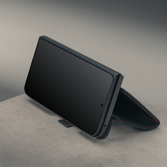Closed phone in the stand function of the Black with Red Stitching Leather Case for the Google Pixel 11 Pro Fold