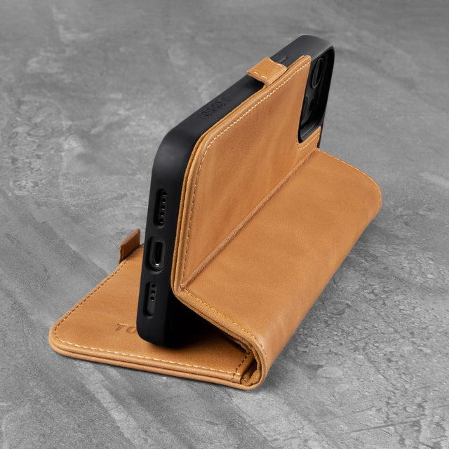 Integrated stand function of the Tan Leather Folio Case for iPhone 13
