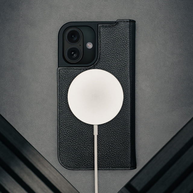 MagSafe charger attached to the Black Leather Case for iPhone 17