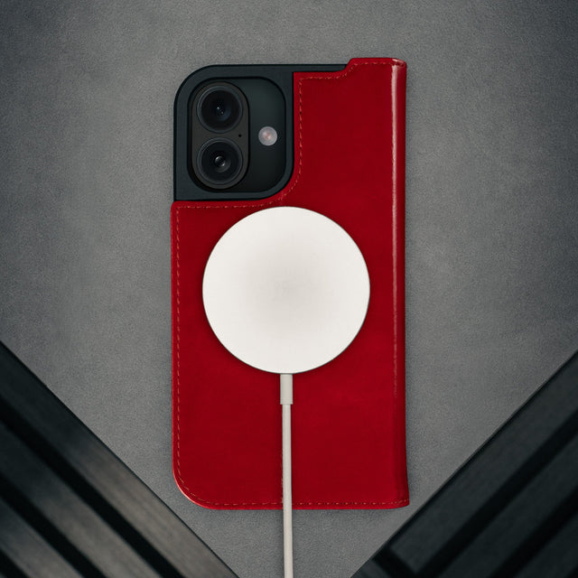 MagSafe charger attached to the Red Leather Case for iPhone 17