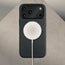 MagSafe charger attached to the Black Leather Bumper Case with Rotating Stand for iPhone 17 Pro Max