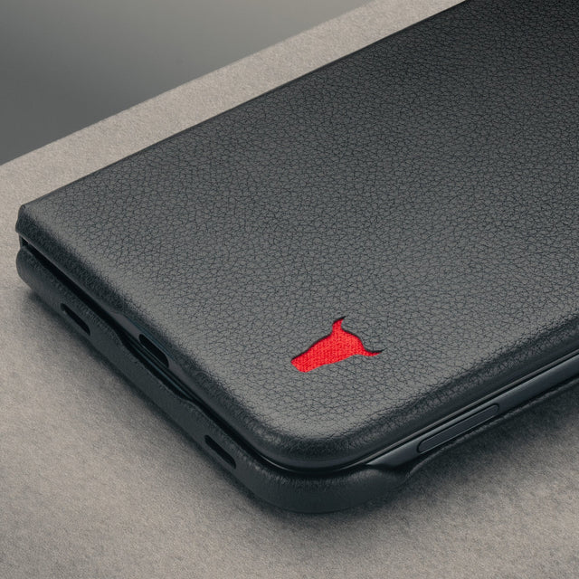 Close up of the Black with red detail Leather Folio Case (with Rotating Stand) for the iPhone Ultra
