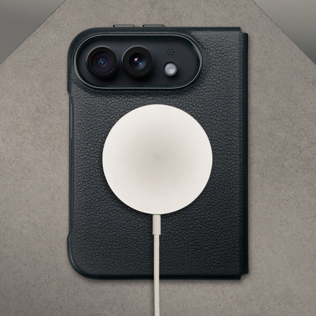 MagSafe charger attached to the Black with red detail Leather Folio Case (with Rotating Stand) for the iPhone Ultra