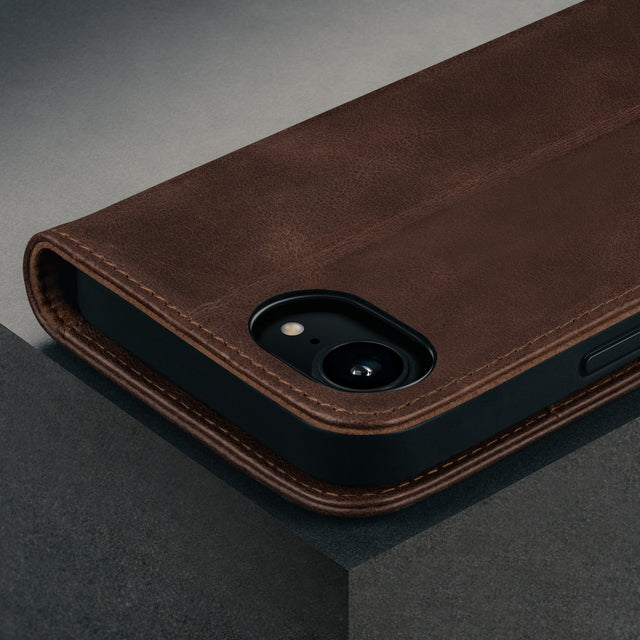 Camera cutout on the Dark Brown Leather Wallet Case for iPhone SE4 (2025)