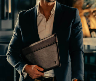 Man carrying the Dark Brown Leather Laptop Folio Sleeve / Conference Wallet