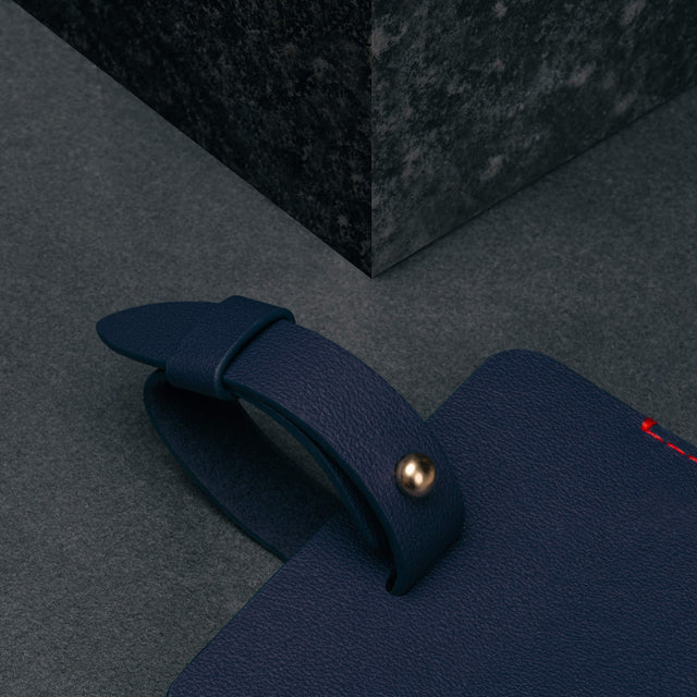 Adjustable strap on the Navy Blue Leather Luggage Tag
