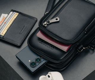 Three zipped compartments of the Black Leather Phone Bag with iPhone and Passport
