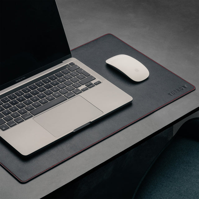 Laptop and mouse on the Small Black with Red Detail Leather Desk Mat