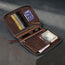 Dark Brown Leather Solo Travel Wallet containing multiple cards, passport, boarding pass and currency