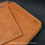 Close up of the storage options in the Tan Leather Solo Travel Wallet