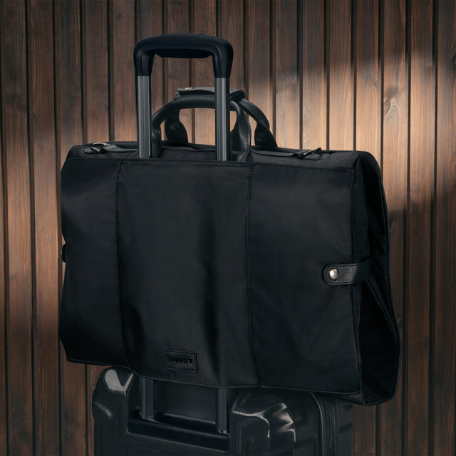 Black Trifold Canvas Suit Carrier / Garment Bag attached to a suitcase
