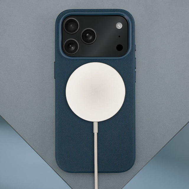 Wireless charger attached to the Blue Woven Texture Bumper Case for iPhone 17 Pro